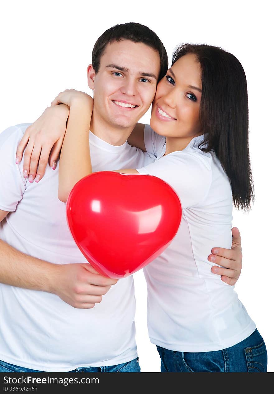 Young couple with a heart over white background