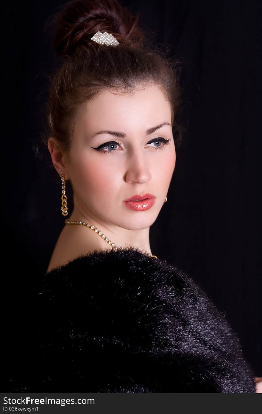 Elegant Woman In A Fur Coat