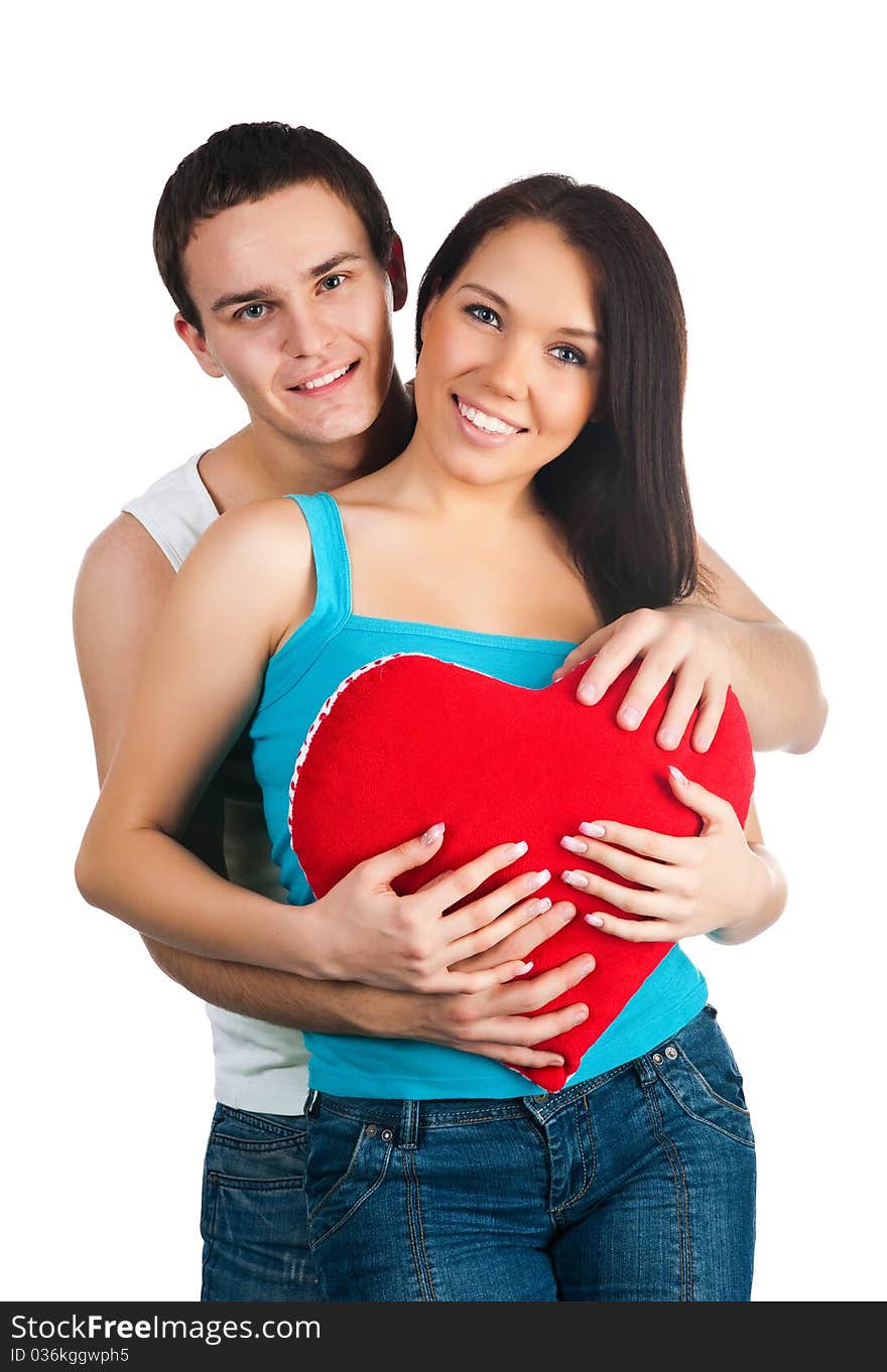 Young couple with a heart over white background