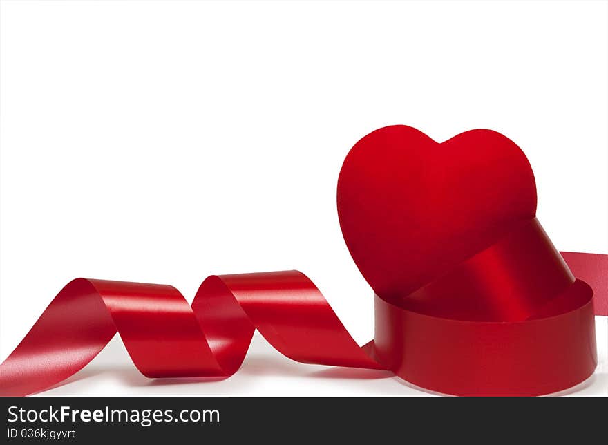 Ribbon and red heart on a white background. Ribbon and red heart on a white background.