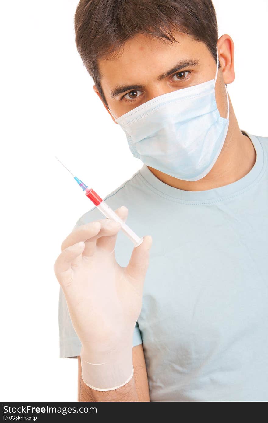 Professional doctor with medical syringe in hands, getting ready for injection