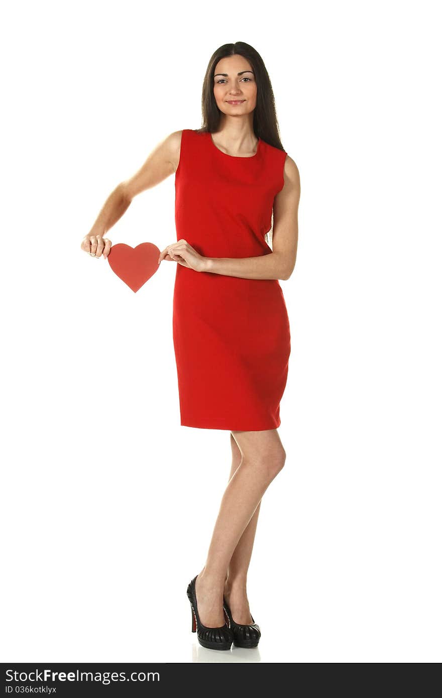 Young elegant female in red pencil-dress holding heart shape isolated on white. Young elegant female in red pencil-dress holding heart shape isolated on white