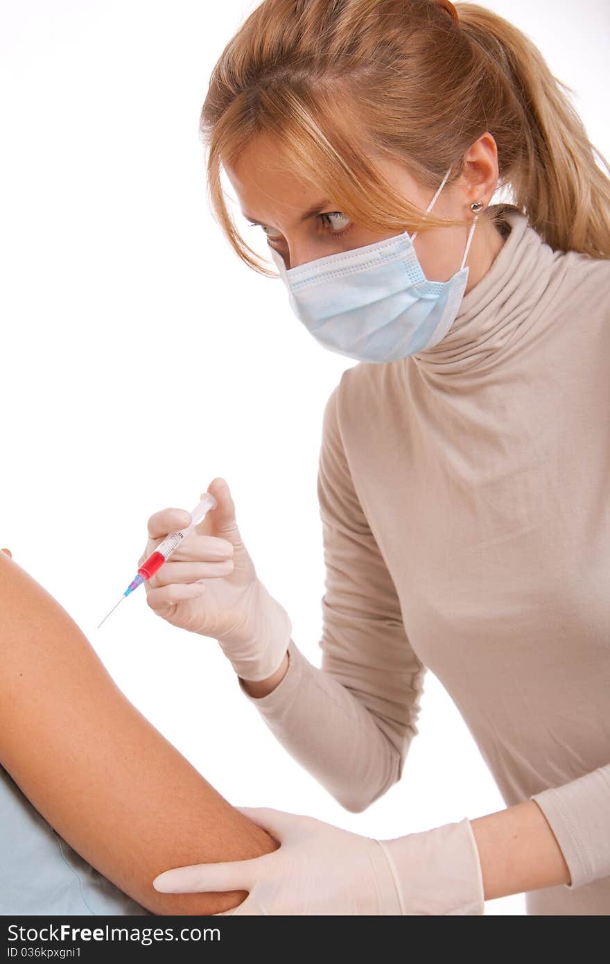 Professional doctor with medical syringe in hands, getting ready for injection