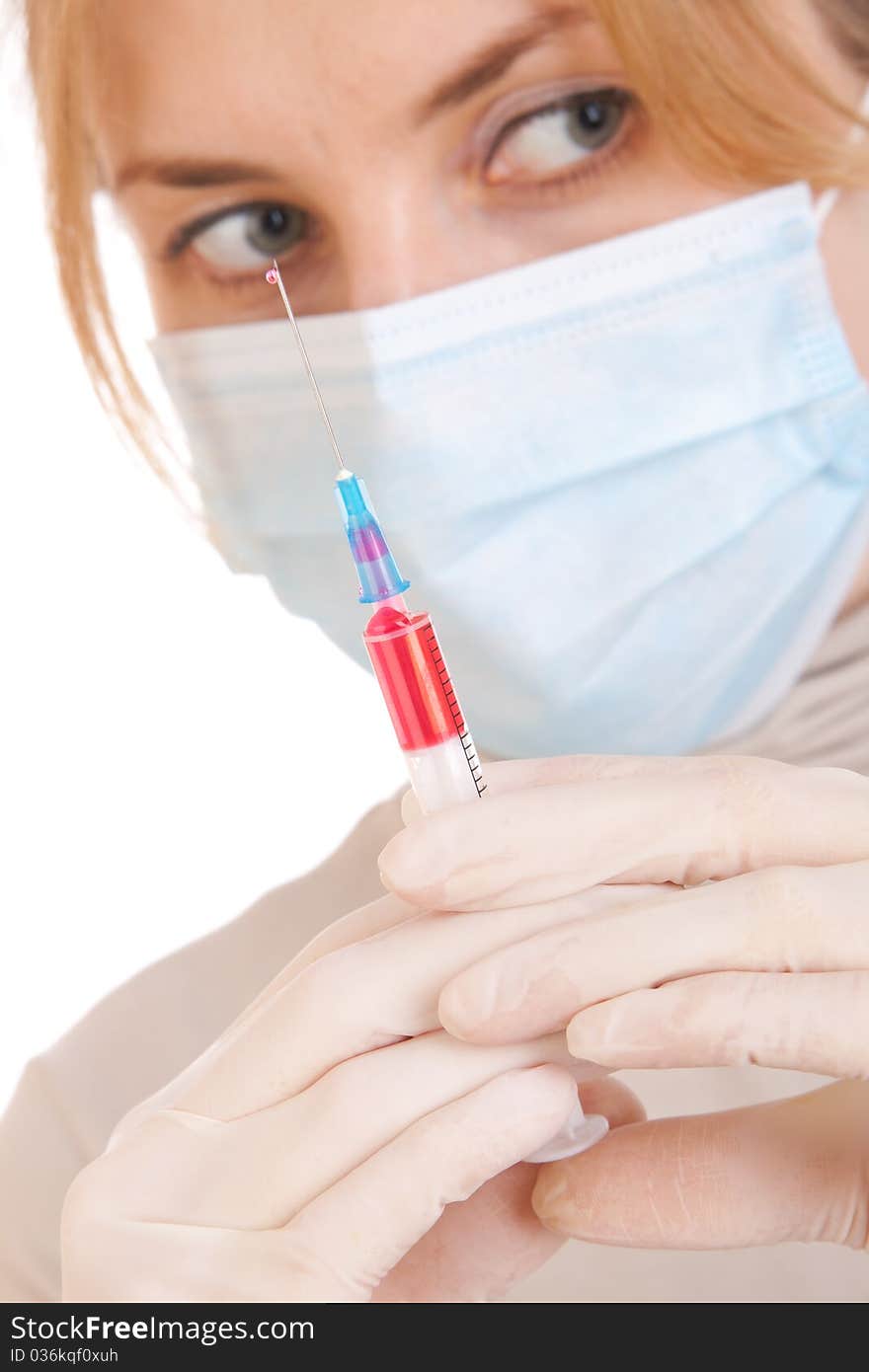 Professional doctor with medical syringe in hands, getting ready for injection