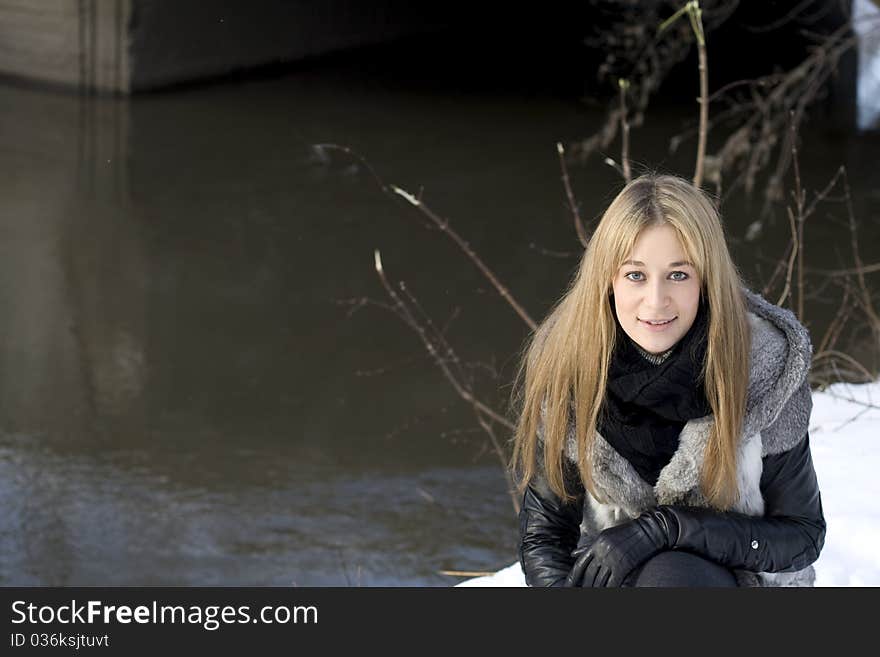 Closeup portrait of a pretty girl in winter park