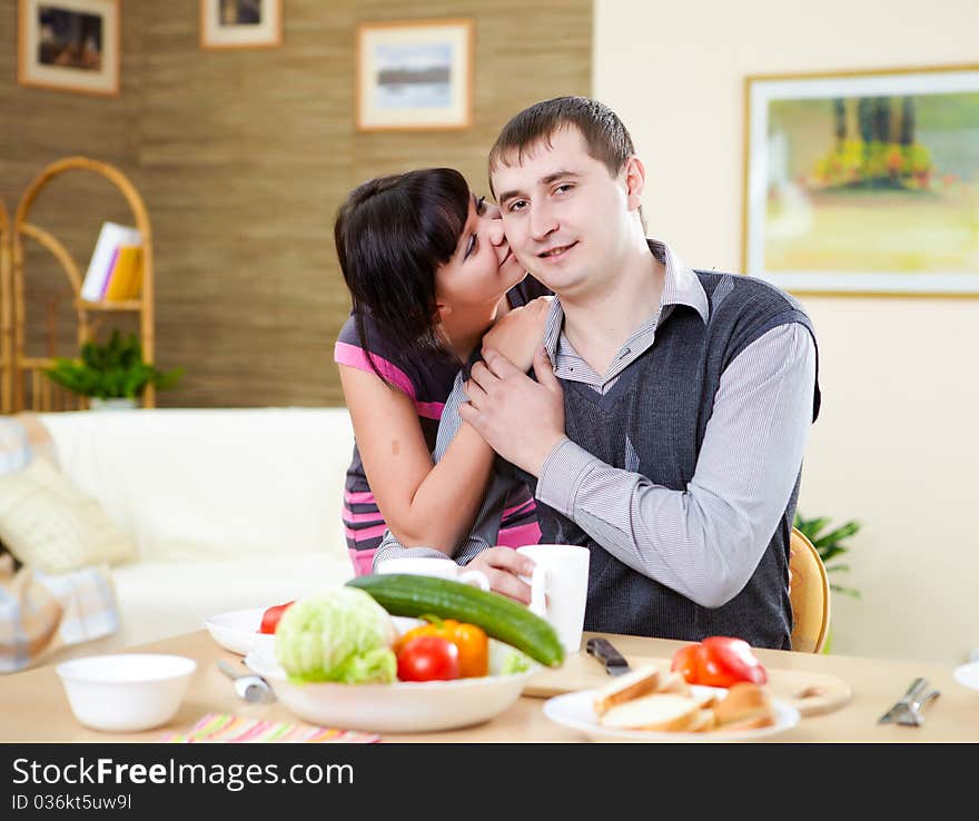 Young couple in love at home eating together and having fun. Young couple in love at home eating together and having fun