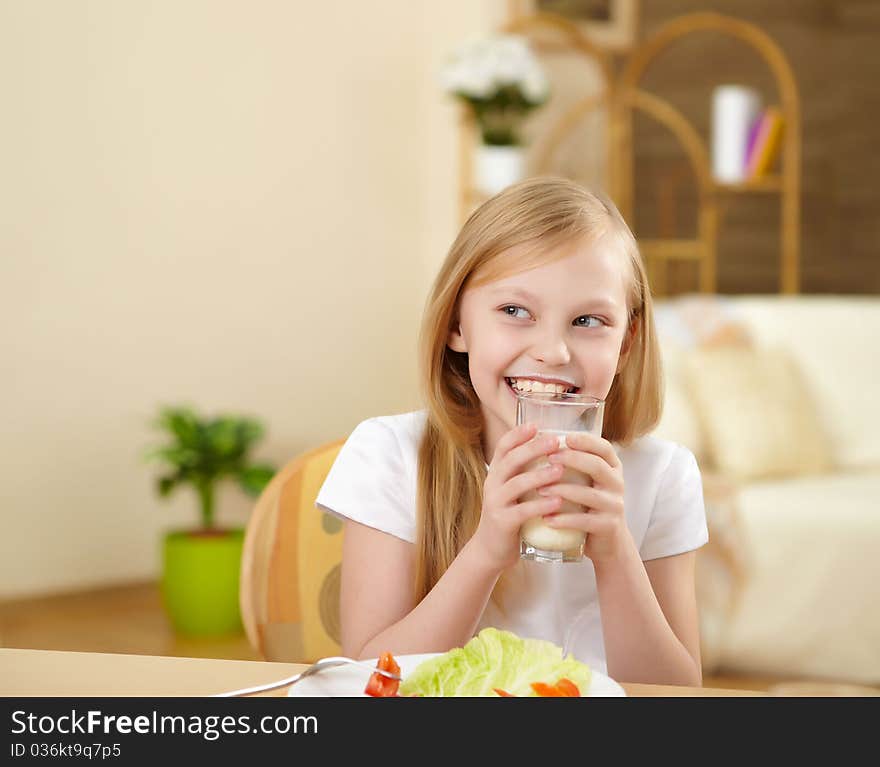 Little girl having meal at home