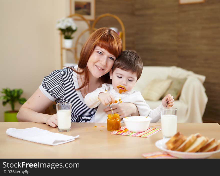 Mother playing with her little son at home on the floor. Mother playing with her little son at home on the floor