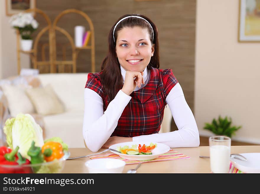 A Young Girl Cooking At Home