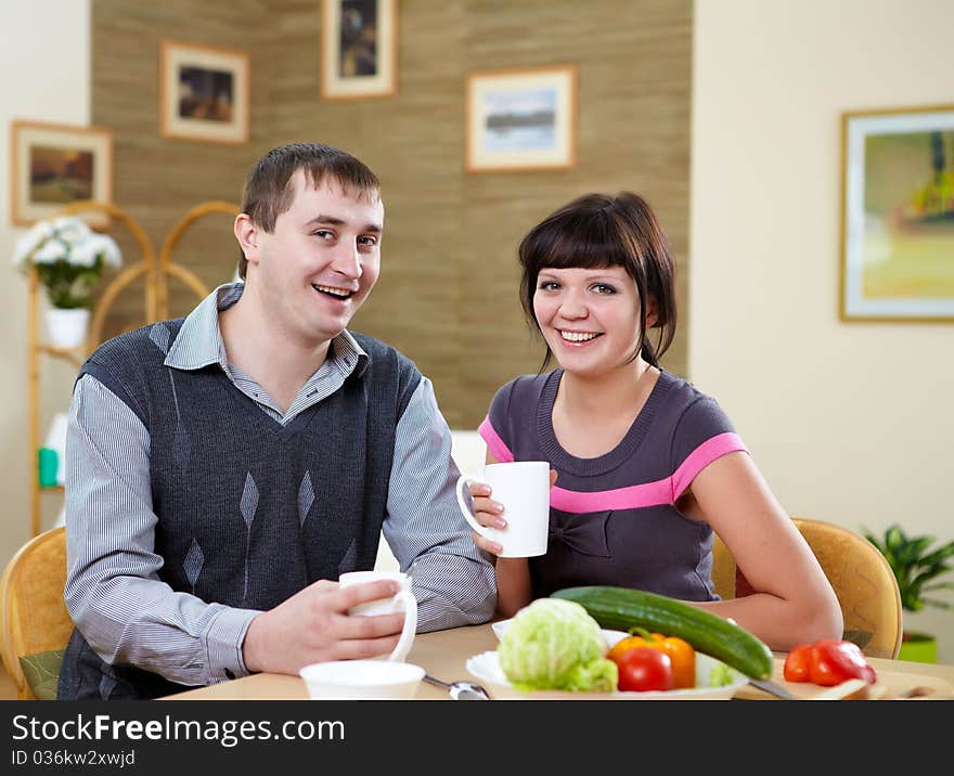 Young couple in love at home eating together and having fun. Young couple in love at home eating together and having fun
