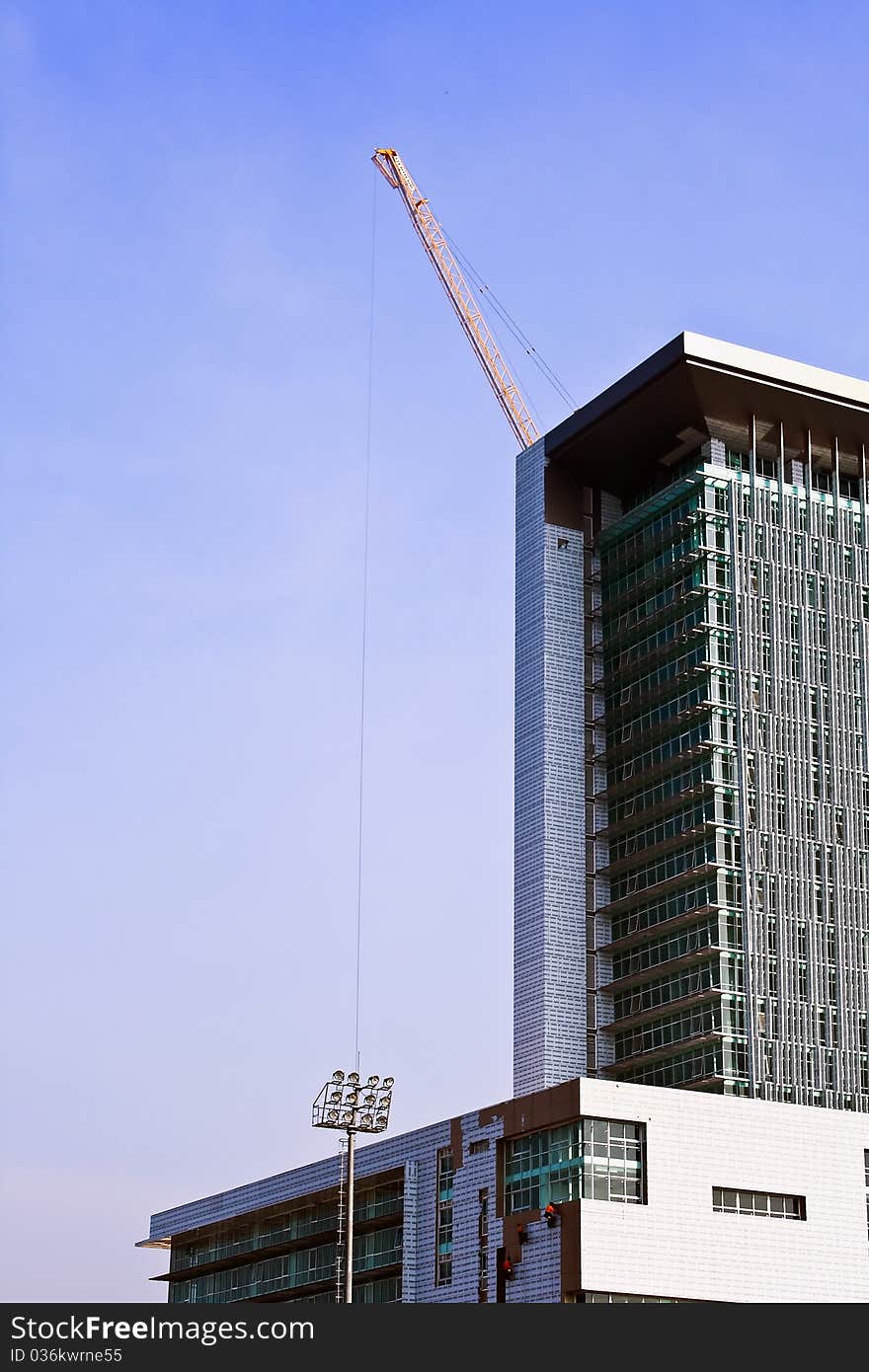 Crane and building under construction on the skyline