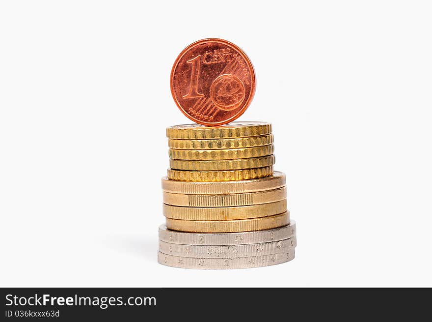 One euro cents stands on a column of coins