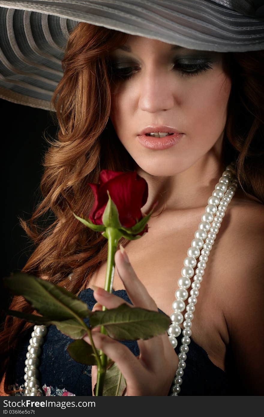 Beauty girl with rose. studio shot