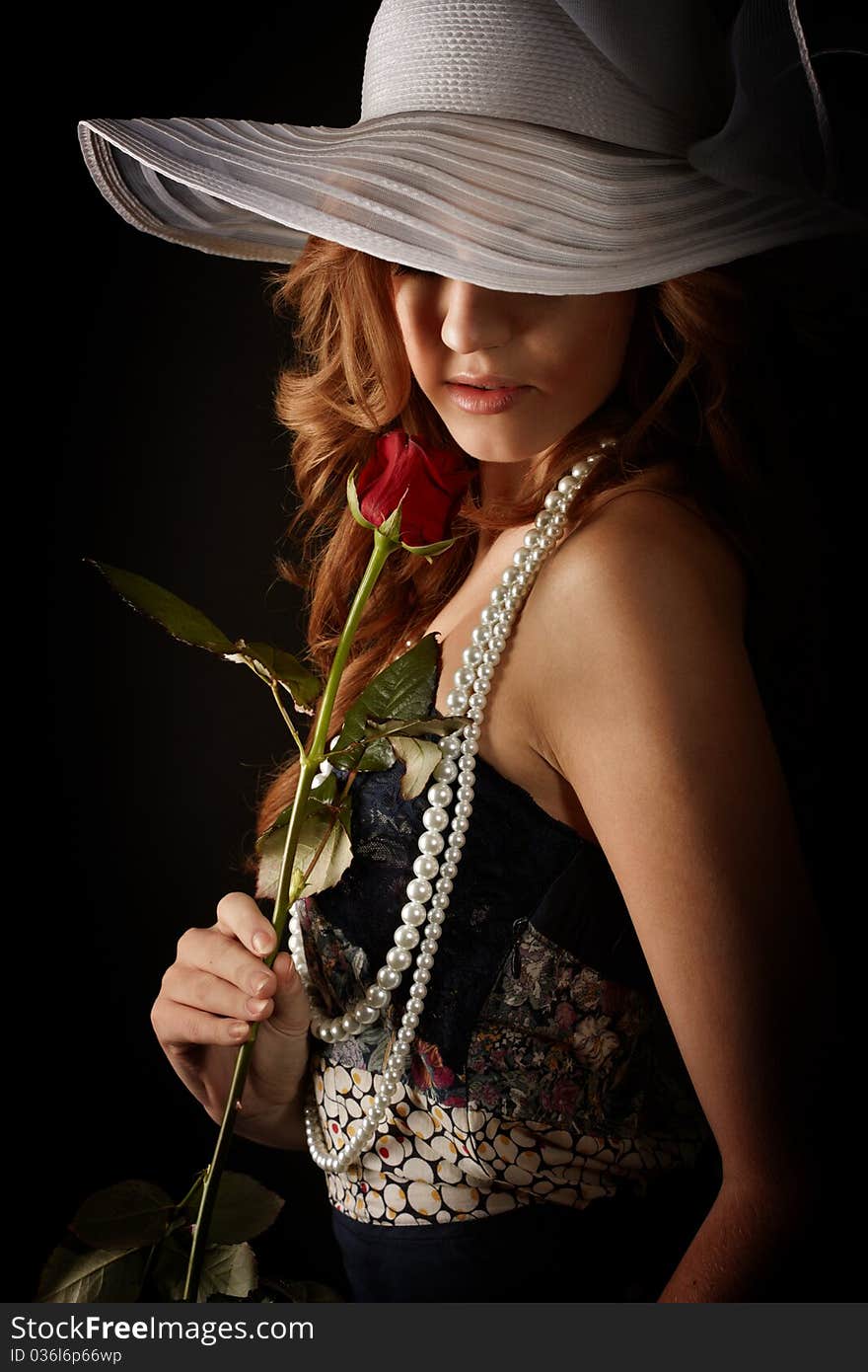 Beauty girl with rose. studio shot