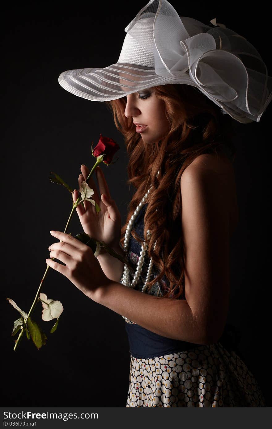 Beauty girl with rose. studio shot