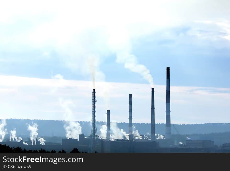 Factory with smokestacks