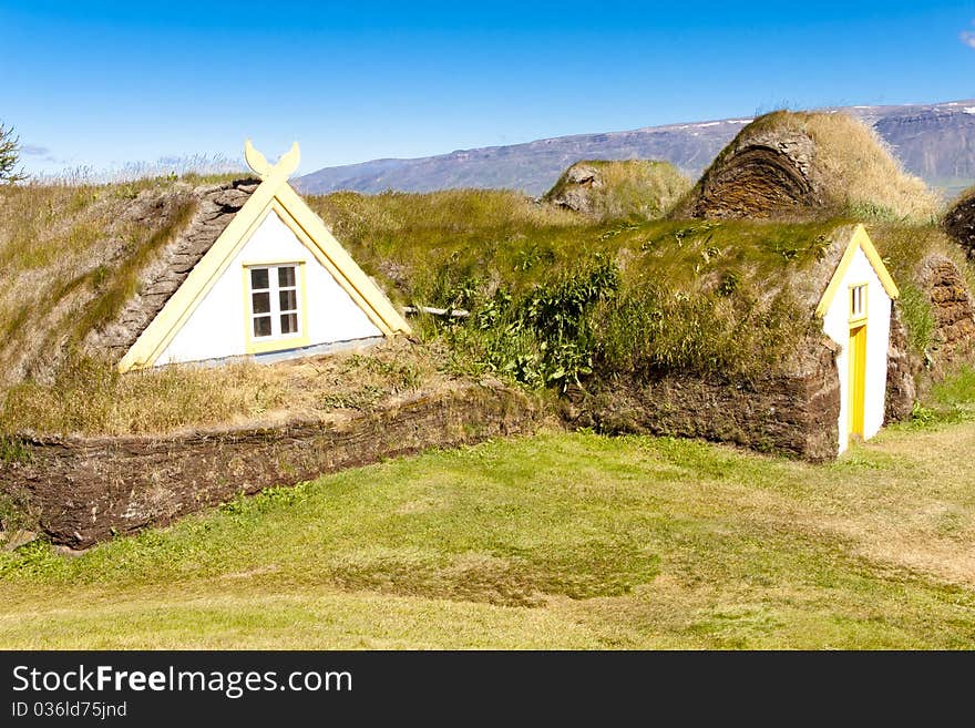 Old typical icelandic farm. Green grass on the roof.