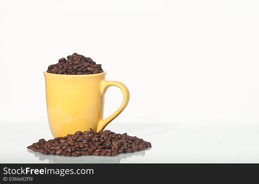 Coffee beans in a mug