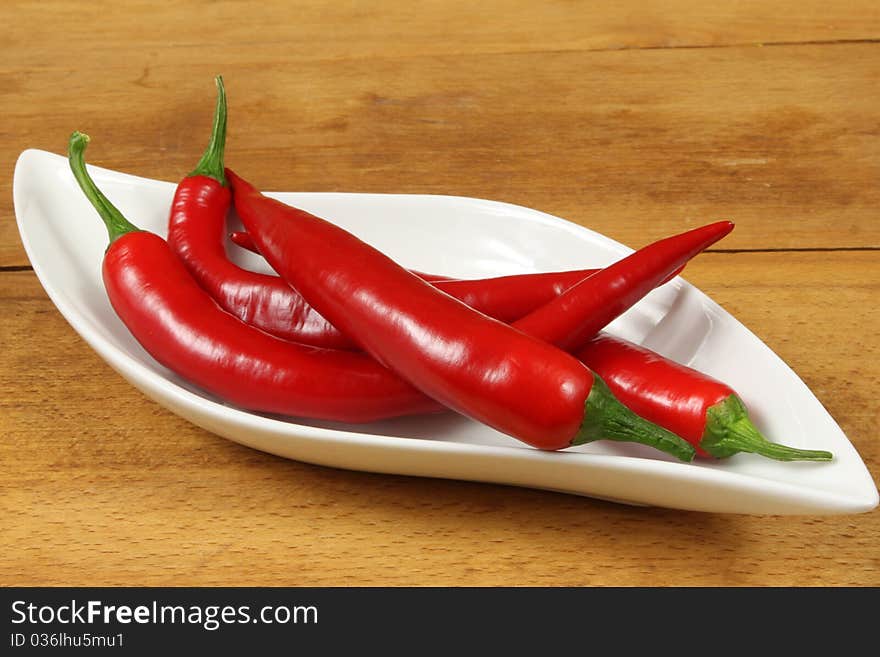 Fresh red cayenne peppers. Vegetables isolated on white.