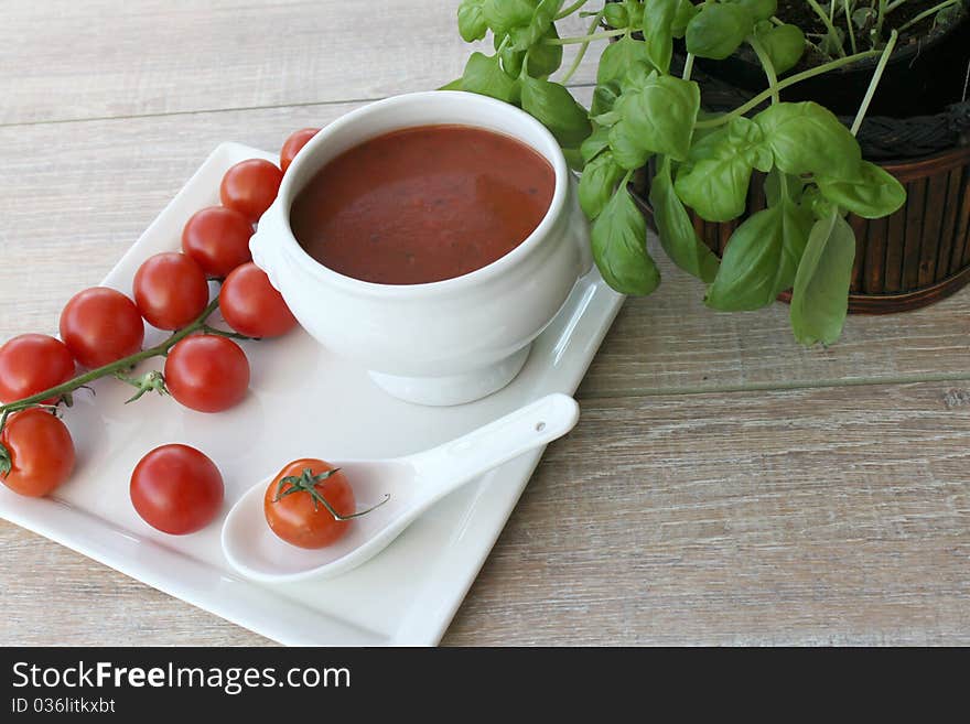 Vegetarian cuisine with basil and tomato soup