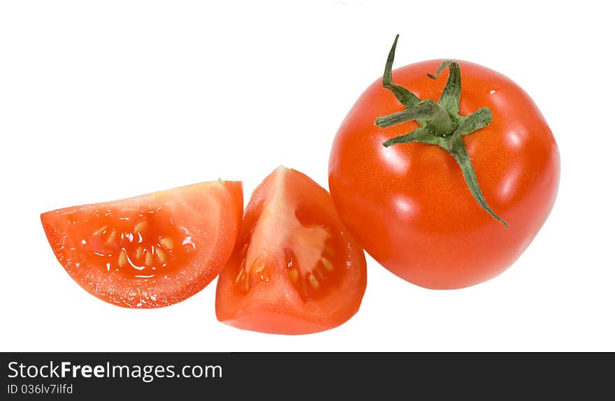 Red tomato with two cropped segments isolated on the white background