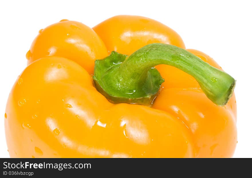 Orange pepper with drops of water isolated on the white