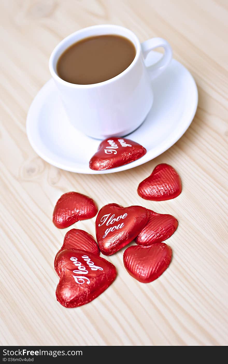 Coffee cup on the table with chocolates. Coffee cup on the table with chocolates.