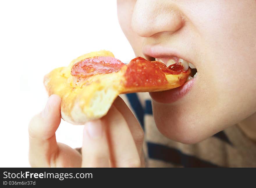 Woman eating pizza on white background