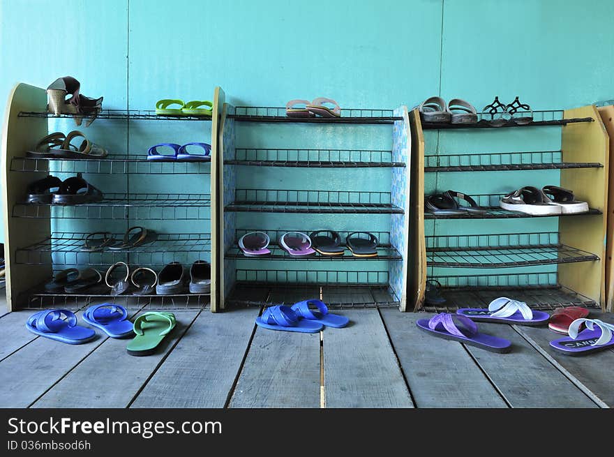 Shoe shelf with green background