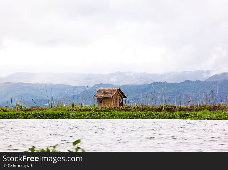 A little hut on the bank near Inle lake, Myanmar. A little hut on the bank near Inle lake, Myanmar