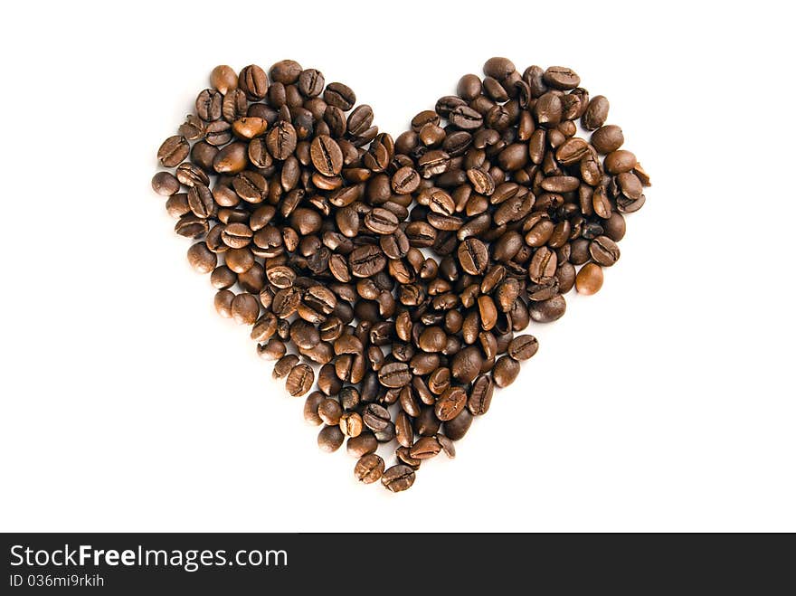 Coffee beans in the form of heart, is isolated on a white background. Coffee beans in the form of heart, is isolated on a white background