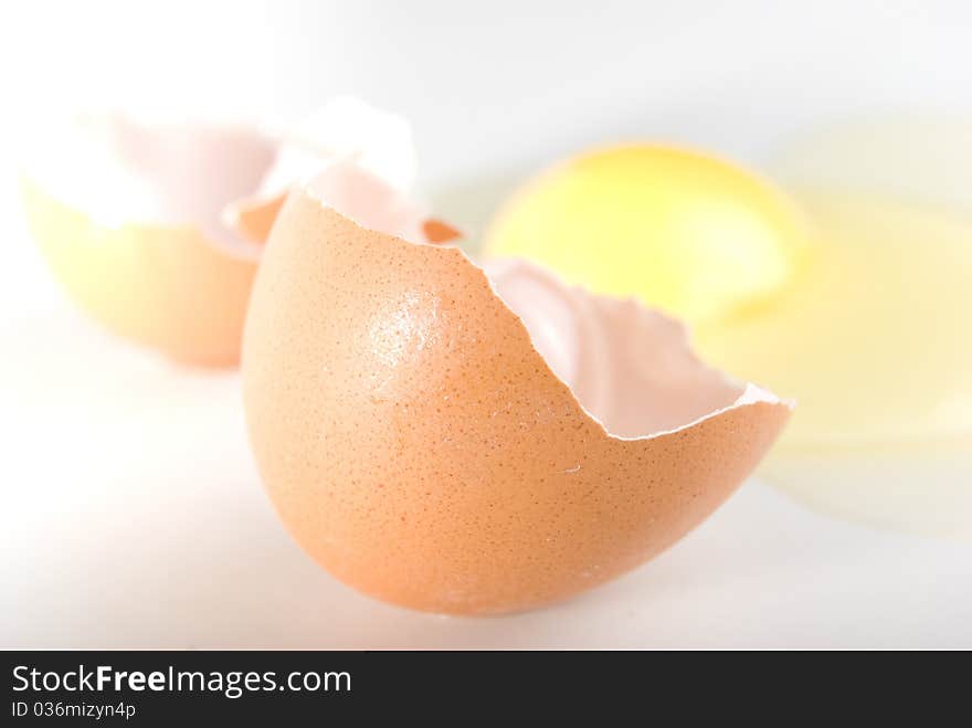 The broken egg on the white background