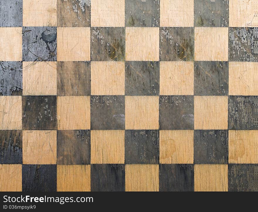 Old chess board texture background. Old chess board texture background