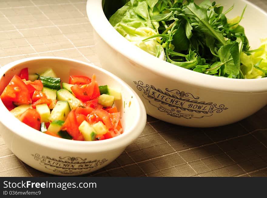 Two Kitchen Bowls Filled With Fresh Salad