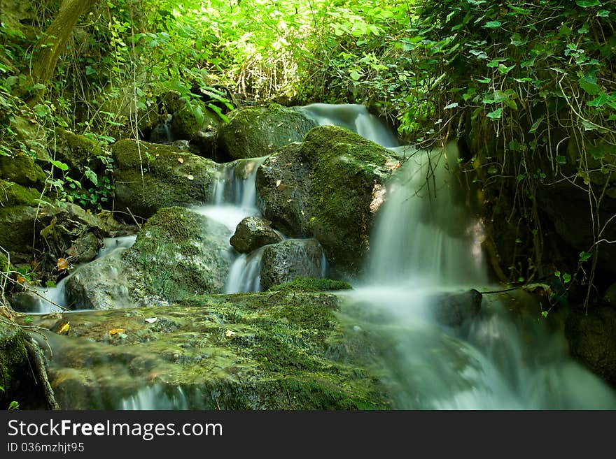 Beautiful waterfall on small forest stream