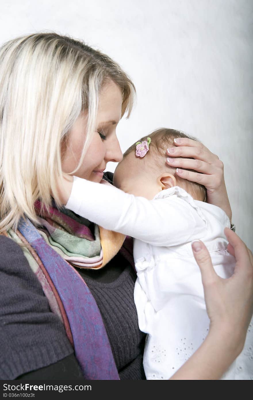 Mother holding her baby in her arms. Mother holding her baby in her arms