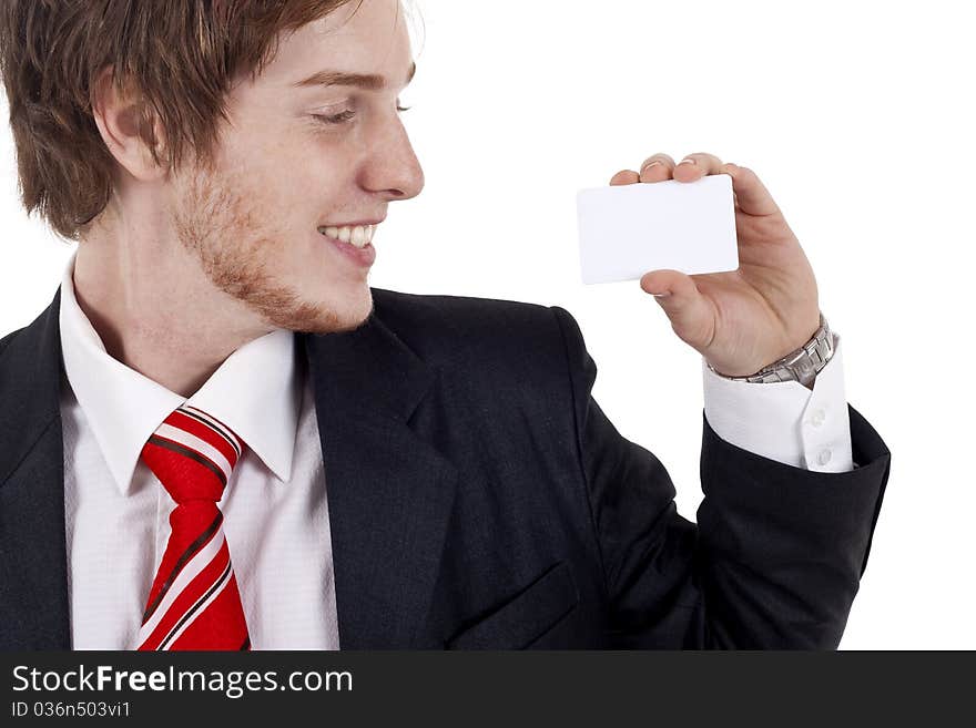 Smiling business man presenting a white business card. Smiling business man presenting a white business card