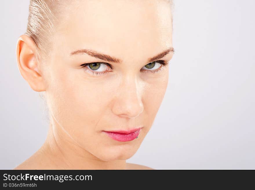 Close up of o beautiful blonde woman with green eyes. Close up of o beautiful blonde woman with green eyes