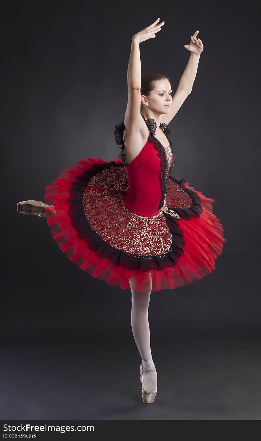 Pretty Ballerina Posing In A Red Tutu