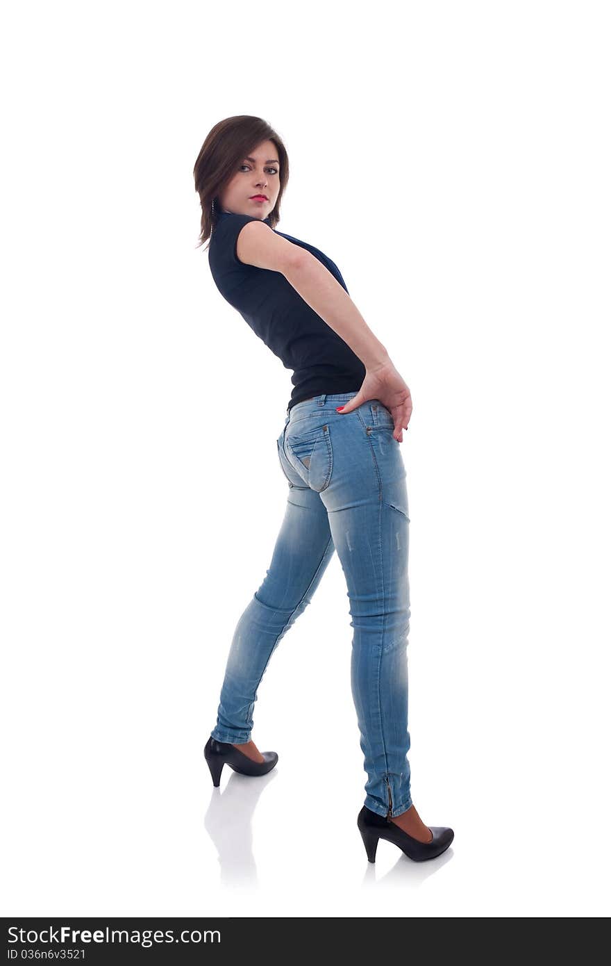 Girl in jeans posing in studio