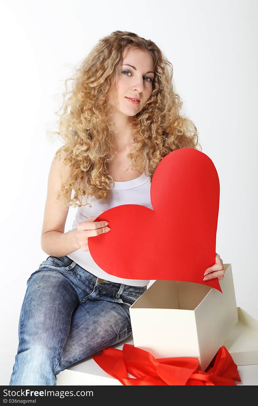 Blond girl with big valentine card