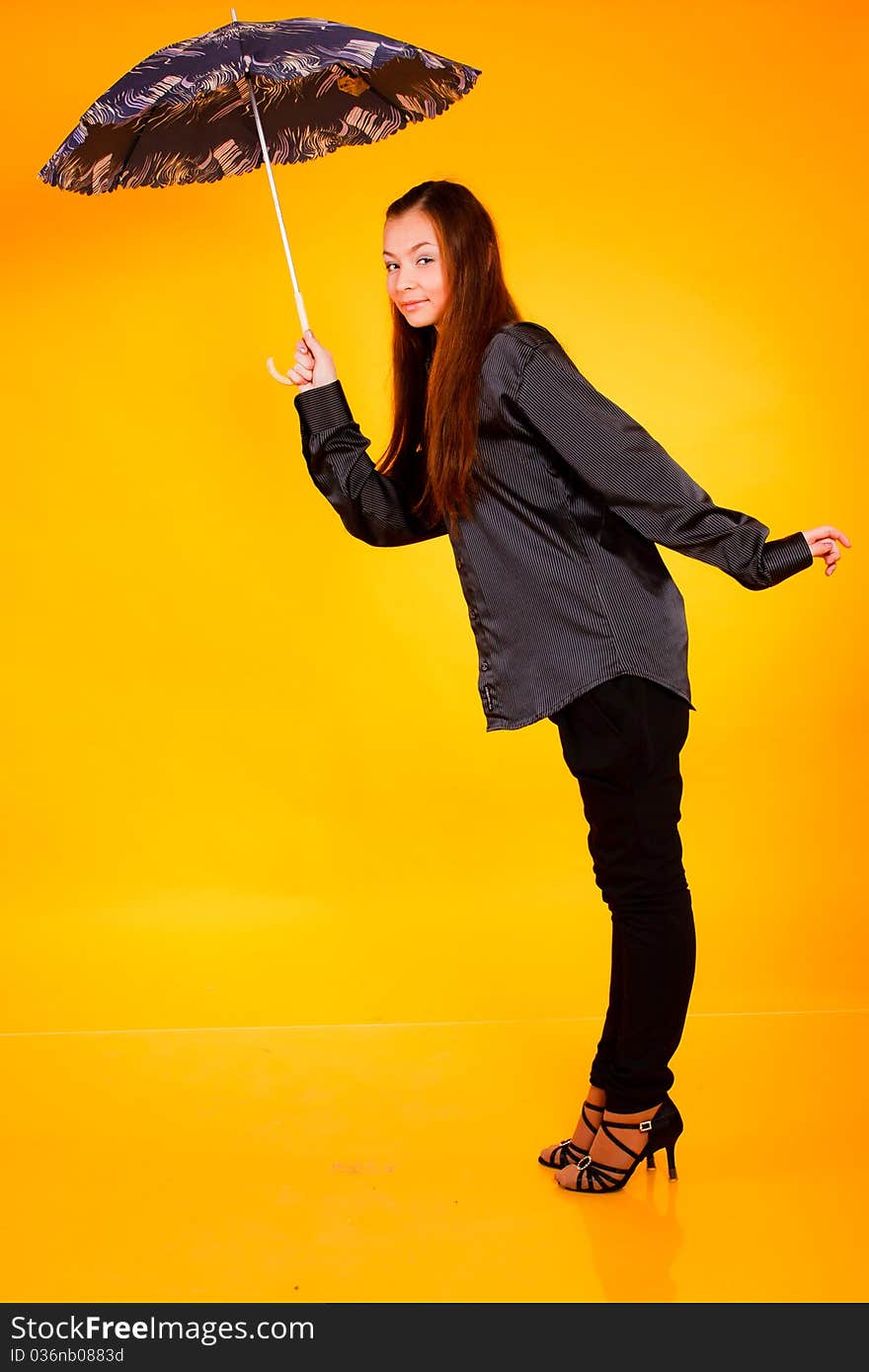 Charming young  woman with an umbrella