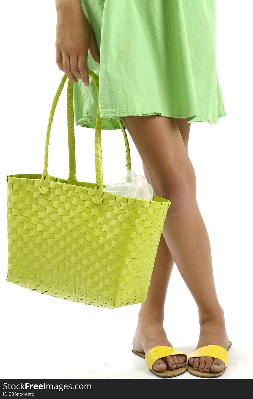 Woman holding a green shopping bag