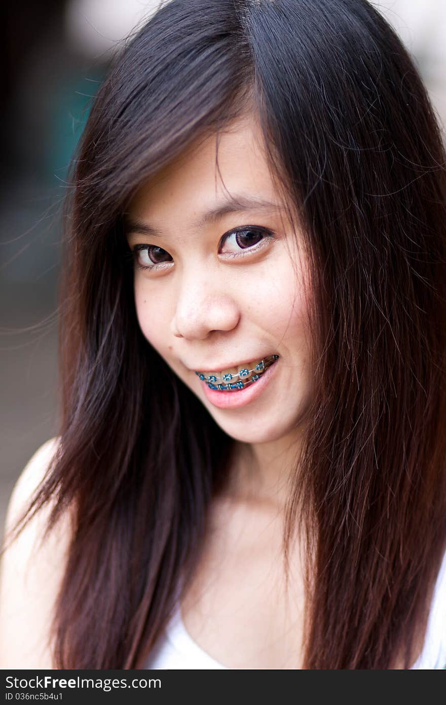 Smiling yound thai girl and color black hair. Smiling yound thai girl and color black hair.