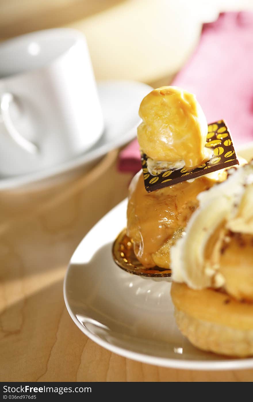 A selection of dessert pastries in a table setting. A selection of dessert pastries in a table setting