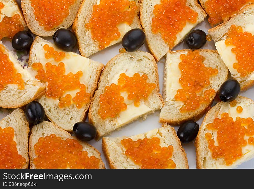 Sandwiches with red caviar, isolated on white