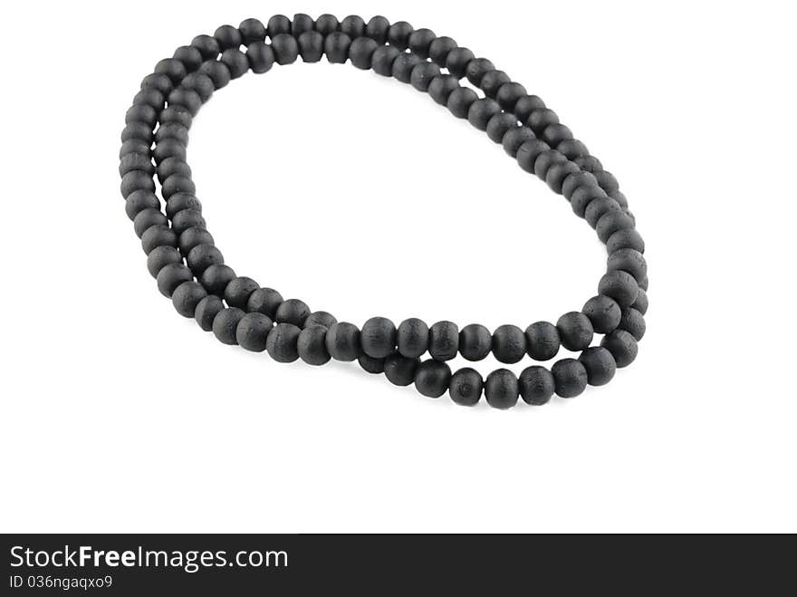 Black wooden beads isolated on white background