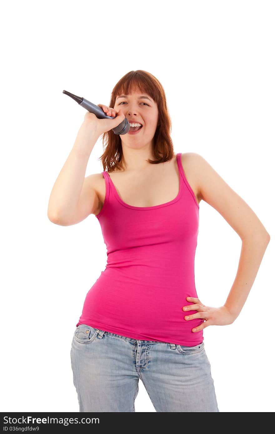 A beautiful young woman with a microphone in her hand. A beautiful young woman with a microphone in her hand