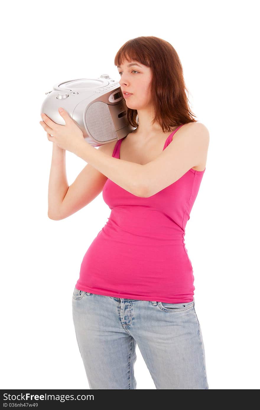 A young beautiful woman is listening to music with a cd player