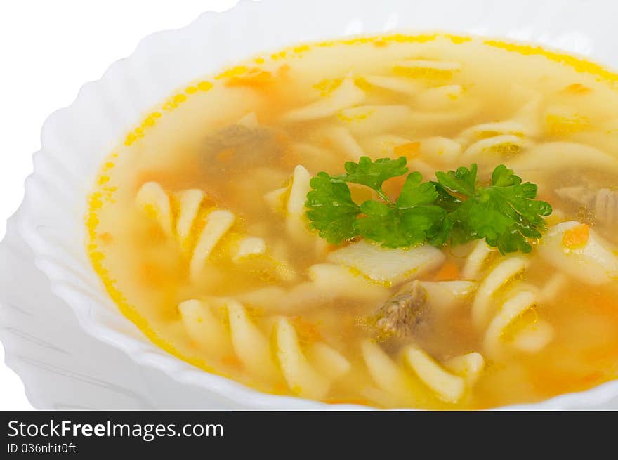 Close-up soup with macaroni and meat, isolated on white